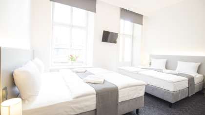 Deluxe Vierbettzimmer mit Balkon